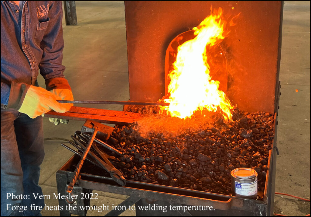 A Craftsman Heating the Wrought Iron