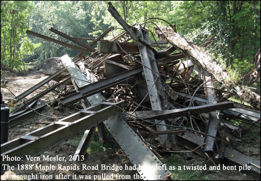 1888 Maple Rapids Road Bridge had been left as a twisted and bent pile of wrought iron after it was pulled from the river.