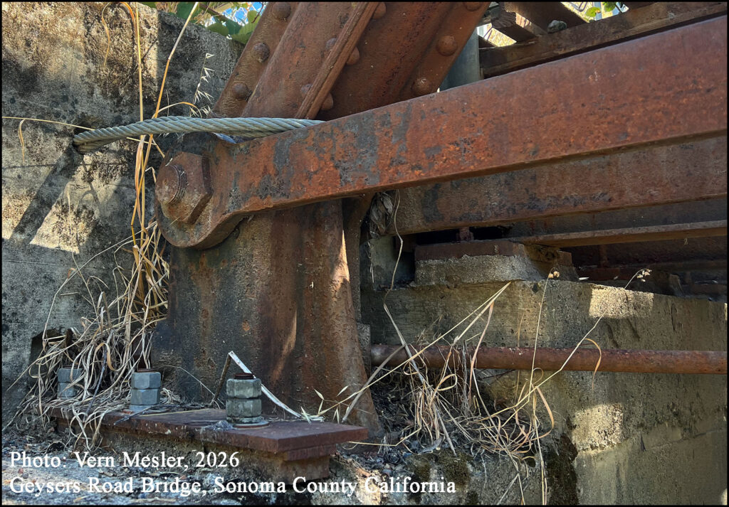 Photo Vern Mesler, 2026 Cast Iron Shoe have been bolted to the concrete piers, and 7/8” galvanized steel cable is wrapped around the bearing pads and embedded in the piers at both end