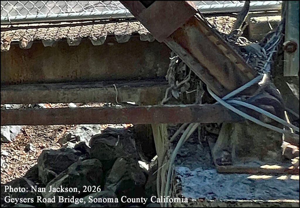 Photo Nan Jackson, 2026 Cast Iron Shoe have been bolted to the concrete piers, and 7/8” galvanized steel cable is wrapped around the bearing pads and embedded in the piers at both end
