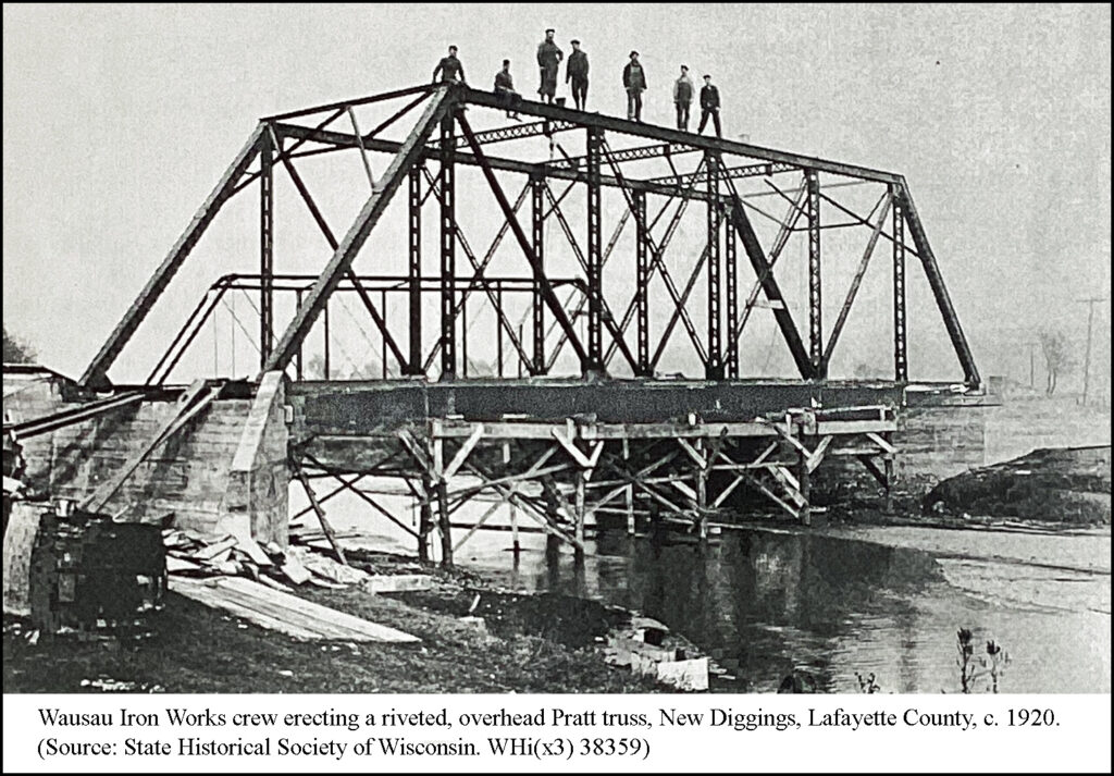Wausau Iron Works crew erecting a riveted, overhead Pratt truss, New Diggings, Lafayette County, c. 1920. (Source: State Historical Society of Wisconsin. WHi(x3) 38359)